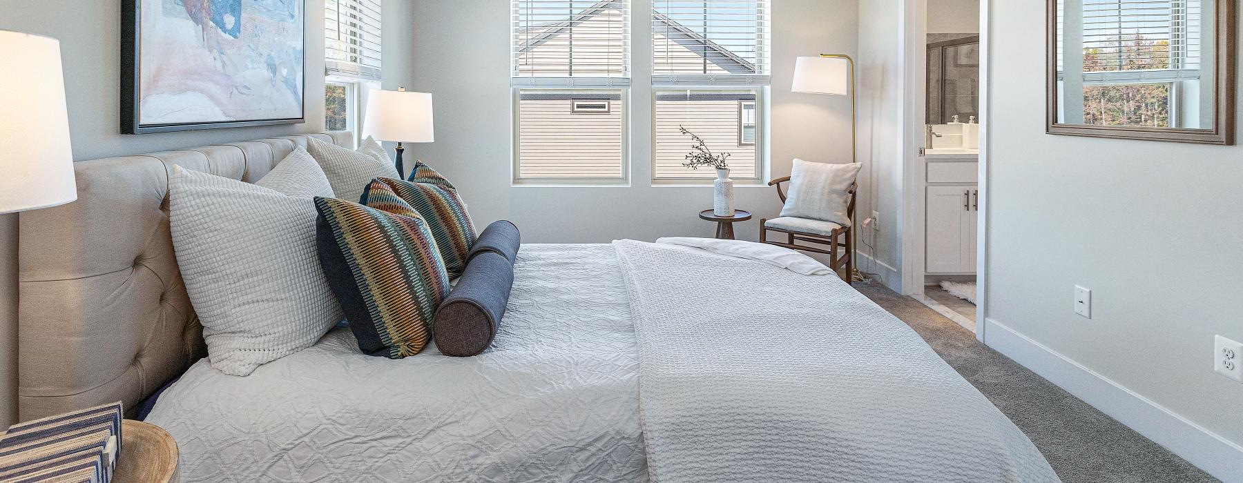 carpeted bedroom with large window