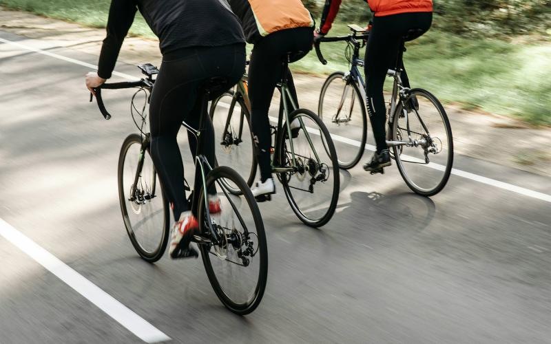 a group of people riding bikes