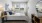 carpeted bedroom with large window