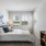 carpeted bedroom with large window