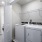 side-by-side washer/dryer units in laundry closet