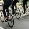 a group of people riding bikes