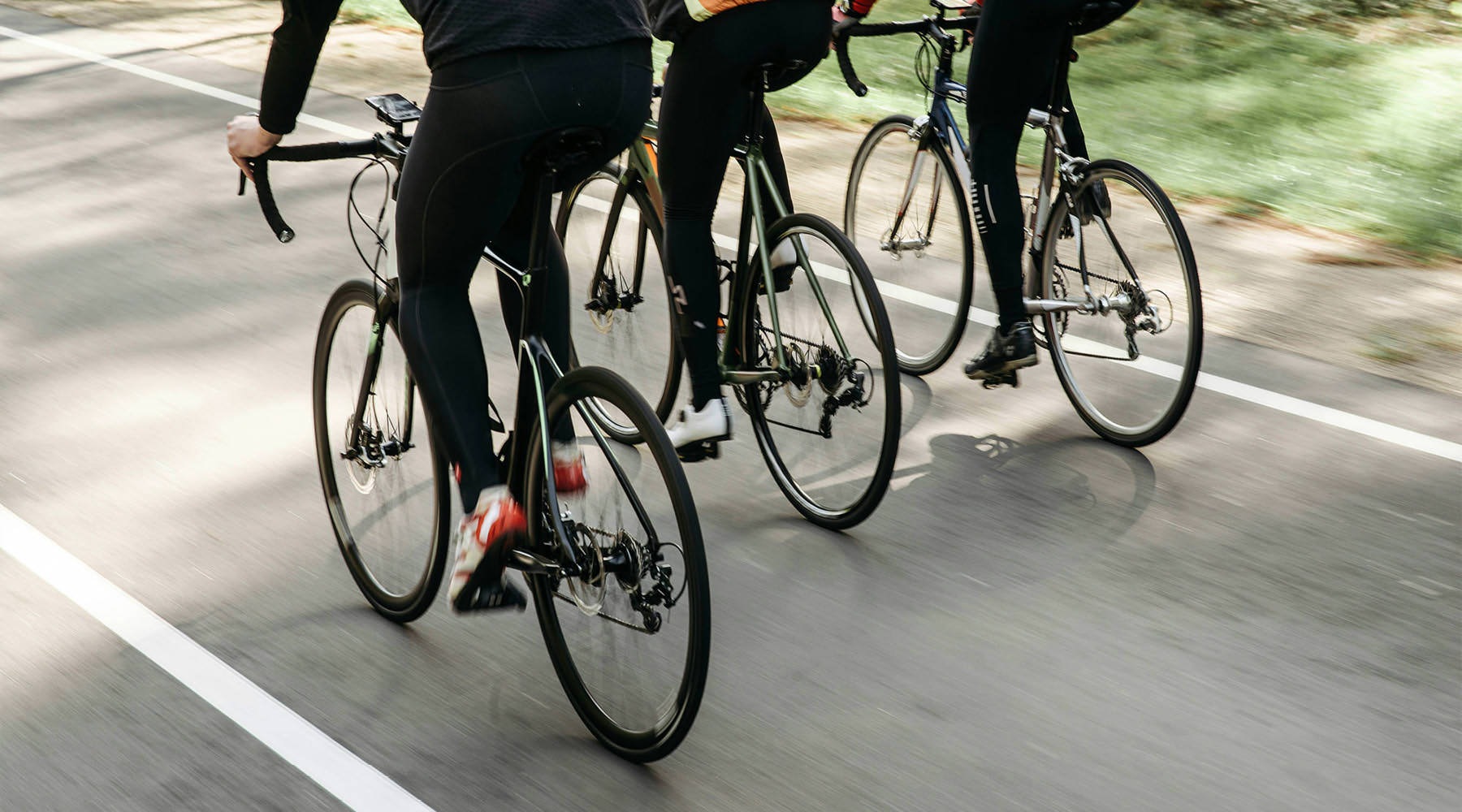 a group of people riding bikes