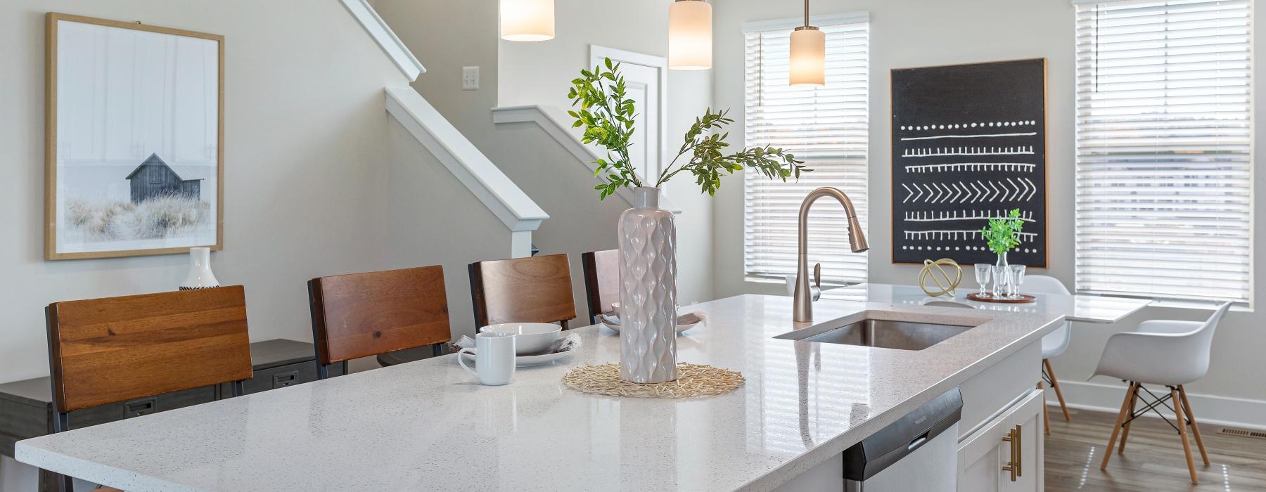 large island with chairs and undermount sink